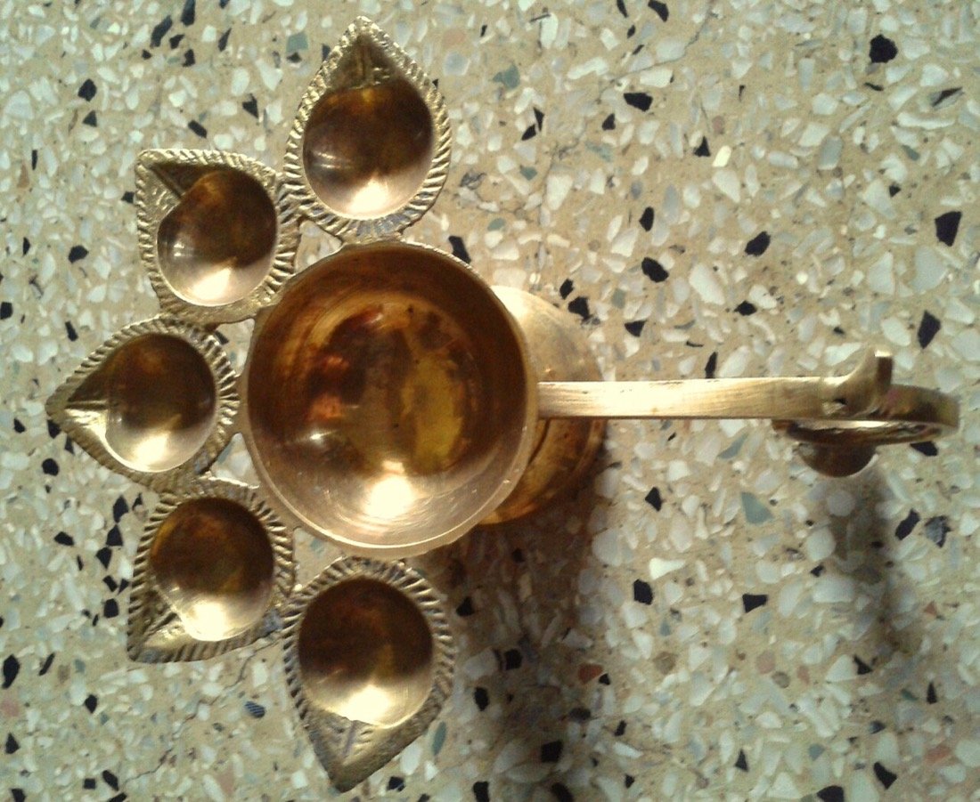 Brass and copper ware — lamps and puja items